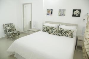 Voodi või voodid majutusasutuse HOTEL HABANA REAL toas