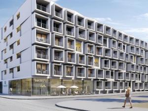an architectural rendering of a building with a woman walking in front at MyRoom - Top Munich Serviced Apartments in Munich