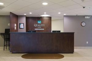 a lobby with a reception desk in a hospital at Quality Inn Seaside in Seaside