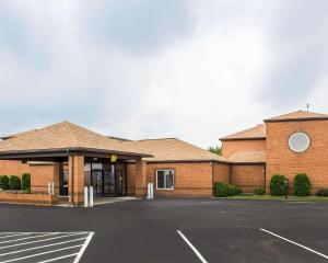 a large brick building with a parking lot at Quality Inn in Clarion