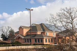 a house with a street light in front of it at Comfort Inn Amish Country in New Holland