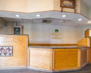 a lobby with a counter with a sign on the wall at Quality Inn New Columbia-Lewisburg in New Columbia +21 photos