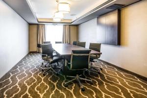 a conference room with a table and chairs on a carpet at Quality Inn & Suites Towanda in Towanda