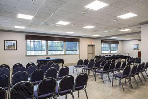 a room with rows of chairs and tables in it at Quality Inn & Suites Greenville - Haywood Mall in Greenville