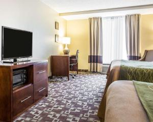 a hotel room with two beds and a flat screen tv at Comfort Inn & Suites Walterboro I-95 in Walterboro