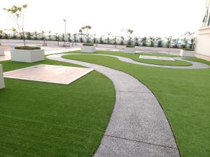 a walkway in a park with green grass at Bangi Studio Suite - Netflix in Kampong Sungai Ramal Dalam