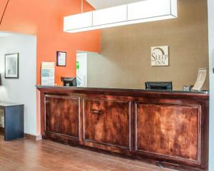 a wooden bar in a salon with at Sleep Inn North Charleston Ashley Phosphate in Charleston