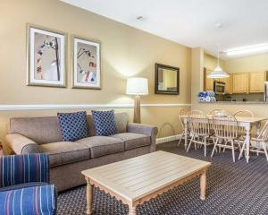 a living room with a couch and a table at Bluegreen Vacations Harbour Lights in Myrtle Beach