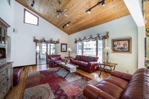 a living room filled with furniture and a large window at K Bar S Lodge, Ascend Hotel Collection in Keystone