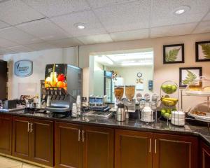 a kitchen with a counter top with fruit and drinks at Sleep Inn Nashville - Brentwood - Cool Springs in Brentwood