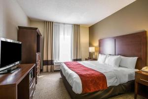 Postel nebo postele na pokoji v ubytování Quality Suites