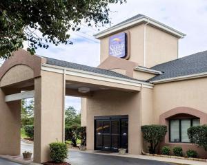 a hotel with a sign on the side of a building at Sleep Inn Nashville North - Downtown Area in Nashville