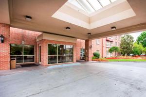 an empty parking lot in front of a brick building at Quality Inn & Suites Germantown North in Memphis