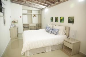 Voodi või voodid majutusasutuse HOTEL HABANA REAL toas