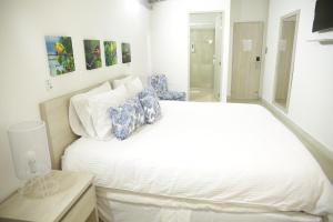 Voodi või voodid majutusasutuse HOTEL HABANA REAL toas