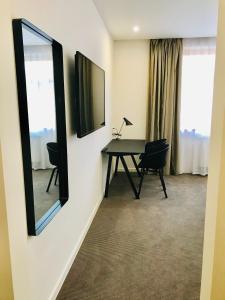 TV a/nebo společenská místnost v ubytování Rozmaryn Hotel B&B