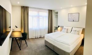 Postel nebo postele na pokoji v ubytování Rozmaryn Hotel B&B