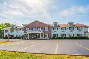 a large building with a parking lot in front of it at Econo Lodge Inn & Suites in Ripley