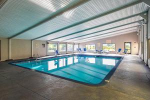 a large indoor swimming pool in a building at Clarion Inn & Suites near Downtown in Knoxville