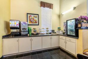 a coffee shop with a counter in a room at Quality Suites North Houston - Spring in Houston