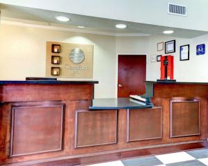 a lobby with a counter and a red refrigerator at Comfort Inn Corsicana East in Corsicana