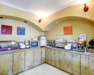 a fast food restaurant with a counter with food at Comfort Suites in Brenham