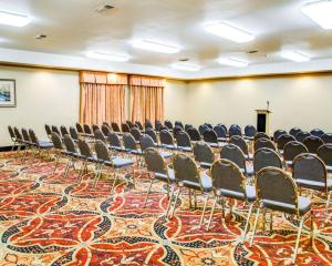 a conference room with chairs and a podium at Comfort Suites Tyler South in Tyler