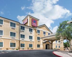a hotel with a sign on the front of it at Comfort Suites Odessa near University in Odessa