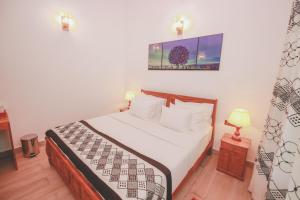 Postel nebo postele na pokoji v ubytování Villa Paradise