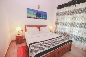 Postel nebo postele na pokoji v ubytování Villa Paradise