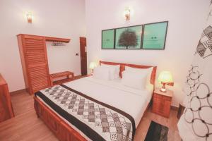 Postel nebo postele na pokoji v ubytování Villa Paradise