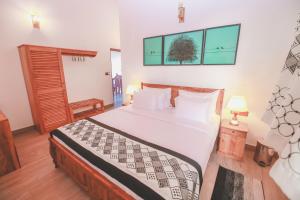 Postel nebo postele na pokoji v ubytování Villa Paradise