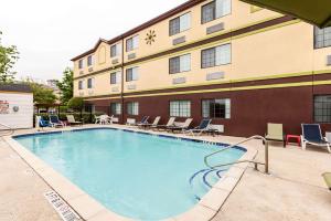 a large swimming pool in front of a hotel at Quality Inn Near Seaworld - Lackland in San Antonio