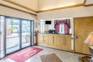 a room with a kitchen with a counter and a door at Econo Lodge Inn & Suites Corpus Christi in Corpus Christi