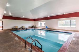 a large pool with blue water in a building at Sleep Inn & Suites Stafford - Sugarland in Stafford