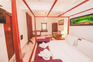 Postel nebo postele na pokoji v ubytování Villa Paradise