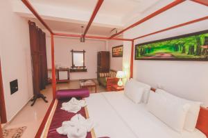 Postel nebo postele na pokoji v ubytování Villa Paradise