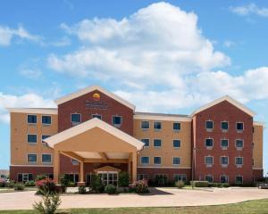 a large brick building with a building at Comfort Inn & Suites Regional Medical Center in Abilene