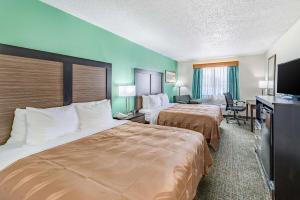 Postel nebo postele na pokoji v ubytování Quality Inn Allen - Plano East