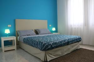 Ένα ή περισσότερα κρεβάτια σε δωμάτιο στο Appartamento Gardenia