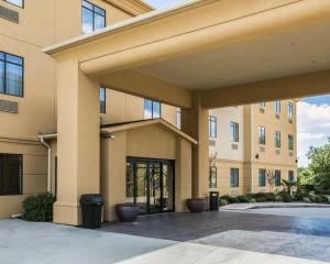 a large building with a courtyard in front of it at Sleep Inn & Suites Highway 290/Northwest Freeway in Houston