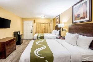 Postel nebo postele na pokoji v ubytování Quality Inn