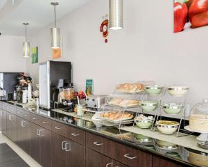a kitchen with a counter with some food on it at Quality Inn & Suites in Bryan