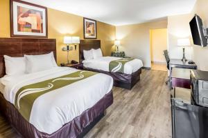 Postel nebo postele na pokoji v ubytování Quality Inn