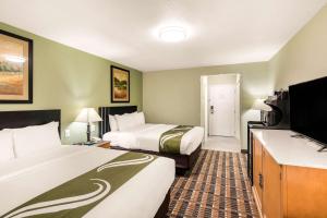 Postel nebo postele na pokoji v ubytování Quality Inn & Suites Plano East - Richardson