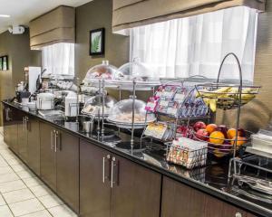 a kitchen with a bunch of food on a counter at Sleep Inn Richmond North in Richmond