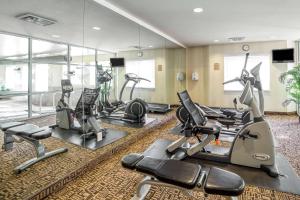 a gym with several exercise bikes and treadmills at Sleep Inn Provo near University in Provo