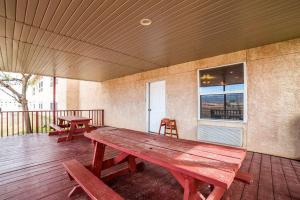 a wooden deck with two benches and a table at Quality Inn Zion Park Area in Hurricane