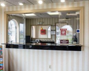 a cashier counter in a store with a window at Econo Lodge Chesapeake Route 13 and I-464 in Chesapeake