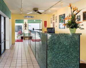 a lobby with a reception counter and a room at Ocean27 Hotel in Virginia Beach